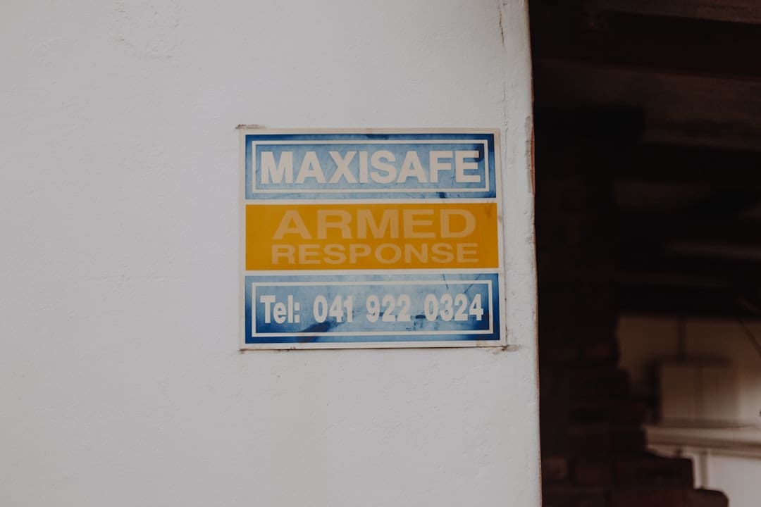 ADA complaint. A blue and yellow sign on a white wall