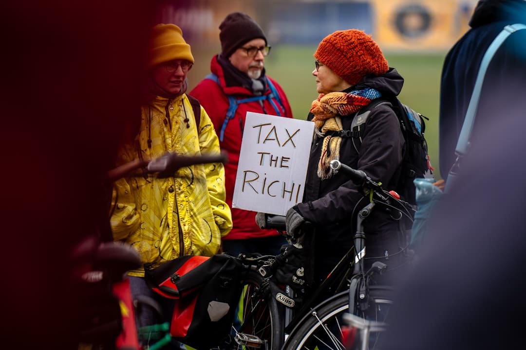 federal laws. A person in a wheelchair holding a sign
