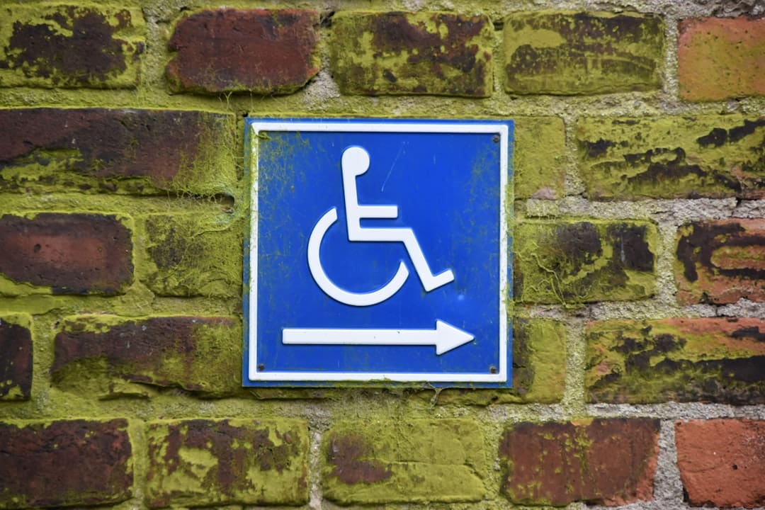 service dog school. PWD sign on brick wall