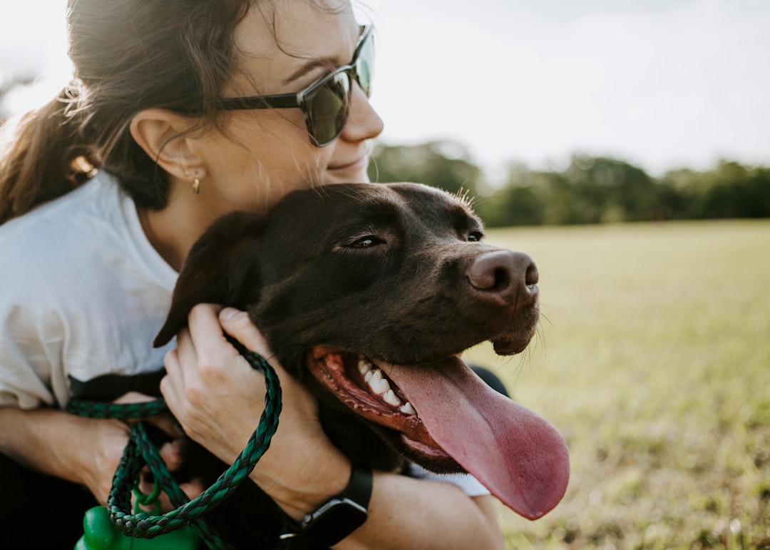 service dog access — woman hugging a dog